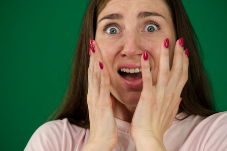 frightened mature woman with bulging eyes in fear, Facial Expressions, Very strong surprise or fright, horror in look, surprised, shocked by news, eventの写真素材