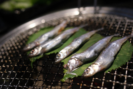 Grilled shishamo fish and Japanese sake.の写真素材