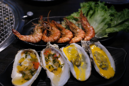 delicious Oysters shrimp Stir fried shrimp and squid on white dishの写真素材
