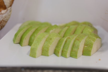 Sliced green guava Stack Guavas on white background