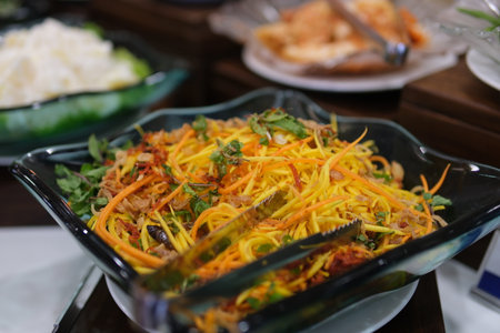 Mix the ingredients to make mango salad.の写真素材