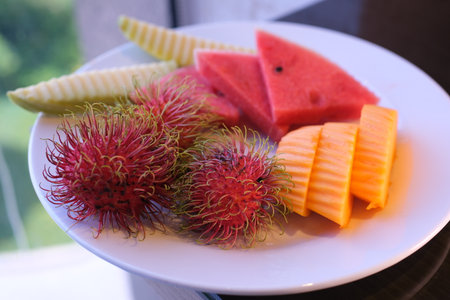 panning rambutan sweet delicious fruit with leaf isolated on white background. top viewの写真素材