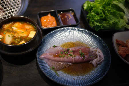 Seafood vegetables sauce. blue plate with seafoodの写真素材