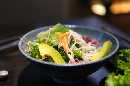 Detox bowl with avocado, spinach, greens, zucchini noodles, grilled shrimps and pesto sauce....