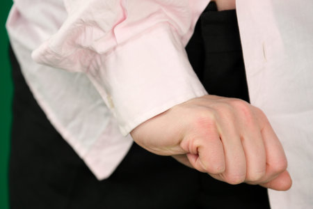 Set of videos showing female hands of young European woman in pink shirt making various gestures on green chroma key background with copy space for advertising and designの写真素材