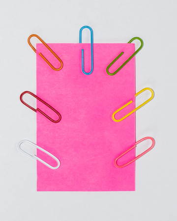 Colorful paperclips and post it on white background isolatedの写真素材