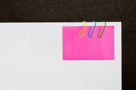 Colorful paperclips and post it on white background isolatedの写真素材