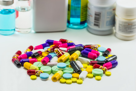 diferent Tablets pills capsule heap mix isolated on white backgroundの写真素材