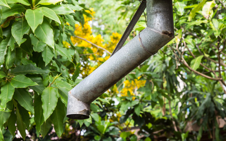 Rain gutter on tree background