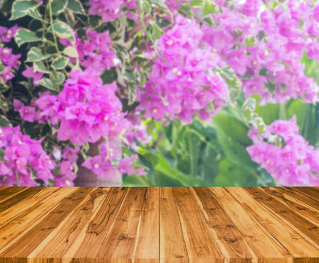 old wood texture with blur Bougainvillea flower in the field background