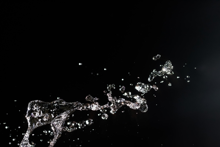 Water splash on black backgroundの写真素材