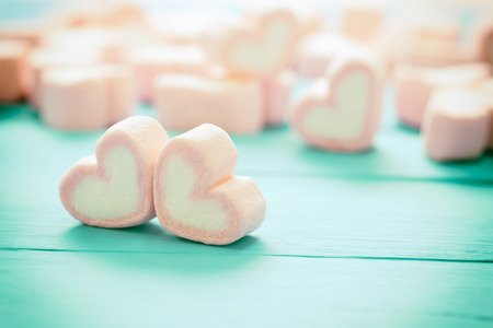 heart shape of marshmallows on wood background, for love and valentine day , vintage toningの写真素材