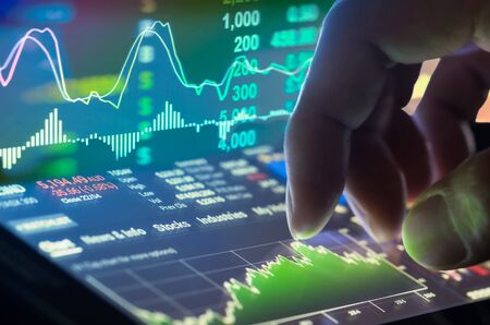Financial data on a monitor,candle stick graph of stock market , stock market data on LED display...