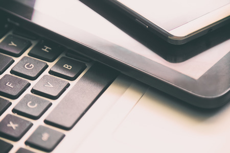 Business accessory. Laptop and smart phone for working business project on wooden table. You can apply for background,backdrop,wallpaper including website decor and artwork design.の写真素材