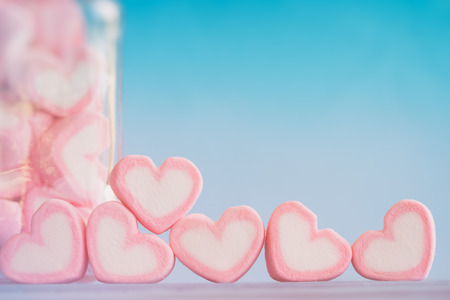 Pink heart shape marshmallow for love theme and Valentine background concept. Pile of heart. Romance pink heart pastel color. Love inspiration from sweet food. Sweet love holiday backgroundの写真素材
