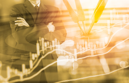 Business man on digital stock market financial and dart background. Digital business and stock market financial on LED. Double exposure target business strategy and digital stock market financial.の写真素材
