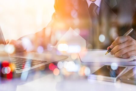 Business man on digital stock market financial indicator background. Digital business and stock market financial indicator on LED. Double exposure of business man and digital stock market financial.の写真素材