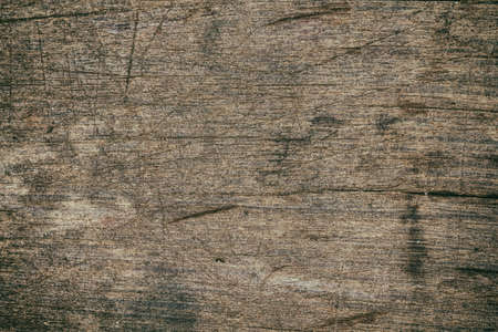 Vintage surface wood table and rustic grain texture background. Close up of dark rustic wall made of...