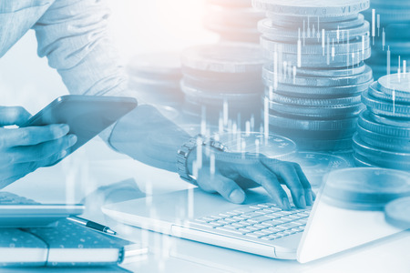 Business man on stock market financial trade indicator background. Man analysis stock market financial trade indices on LED. Double exposure of business man trade on stock market financial concept.の写真素材