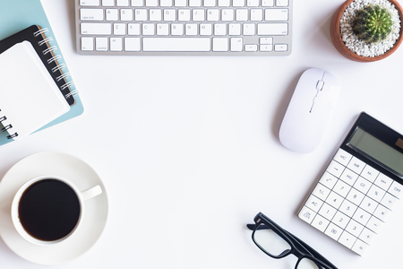 White desk office with laptop, smartphone and other work supplies with cup of coffee. Top view with copy space for input the text. Designer workspace on desk table essential elements on flat lay.の写真素材