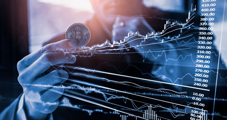 Modern way of exchange. Bitcoin is convenient payment in global economy market. Virtual digital currency and financial investment trade concept. Abstract cryptocurrency with gold bitcoin background.の写真素材