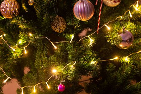 Holiday Christmas card background with festive decoration ball, stars, snowflakes, gift box, pine...