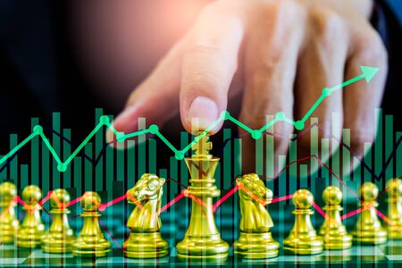 Chess game on chess board on stock market or forex trading graph chart for financial investment...