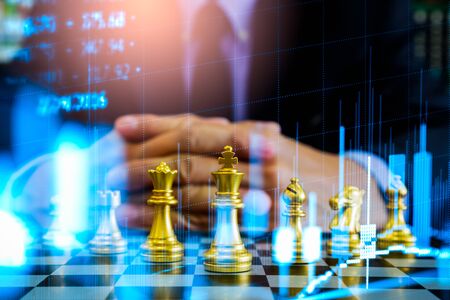 Chess game on chess board on stock market or forex trading graph chart for financial investment concept. Economy trends for digital business marketing strategy analysis. Abstract finance background.の写真素材