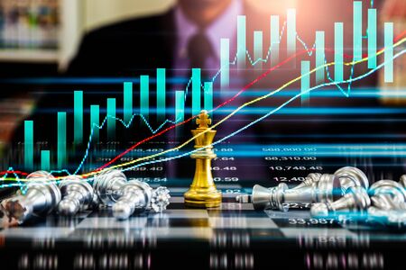 Chess game on chess board on stock market or forex trading graph chart for financial investment...