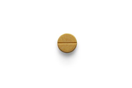 Single orange color pill of vitamin c on white background with clipping path. Pharmaceutical or drugs and medical concept.の写真素材
