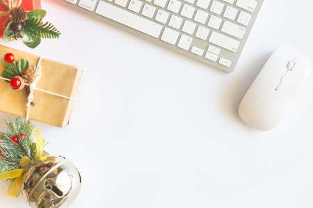 White Christmas, desk office with laptop, decoration and work supplies with cup of coffee. Top view...