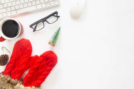 White Christmas, desk office with laptop, decoration and work supplies with cup of coffee. Top view with copy space for input the text. Flat lay desk table winter Christmas. Business Holidays Concept.の写真素材