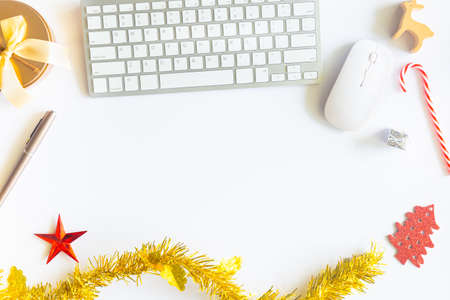White Christmas, desk office with laptop, decoration and work supplies with cup of coffee. Top view with copy space for input the text. Flat lay desk table winter Christmas. Business Holidays Concept.の写真素材