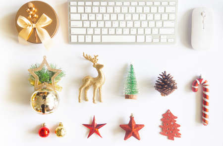 White Christmas, desk office with laptop, decoration and work supplies with cup of coffee. Top view with copy space for input the text. Flat lay desk table winter Christmas. Business Holidays Concept.の写真素材