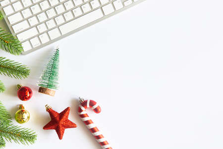 White Christmas, desk office with laptop, decoration and work supplies with cup of coffee. Top view...