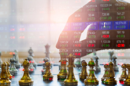 Chess game on chessboard behind businessman