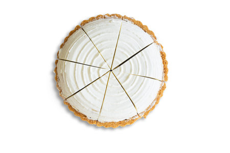 Homemade coconut pie on white isolated background with clipping paths. Plain sponge cake frosting...