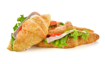 croissant sandwich with hum and tomato isolated. fast snack foodの写真素材