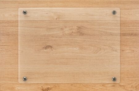 3d rendering glass board or acrylic frame on wooden backgroundの写真素材