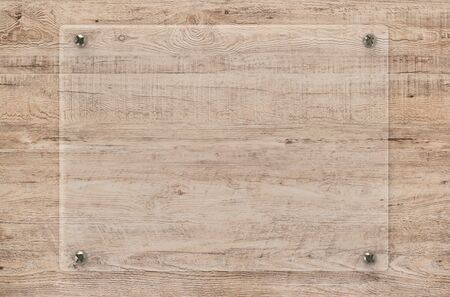 3d rendering glass board or acrylic frame on wooden backgroundの写真素材