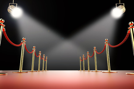 3d rendering red carpet and rope barrier with shining spotlightsの写真素材