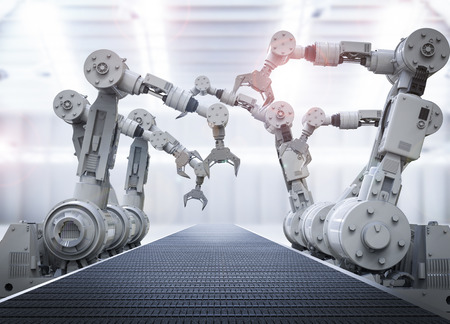 3d rendering robotic arms with empty conveyor beltの写真素材