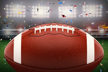 3d rendering american football ball with shining light and confetti backgroundの写真素材