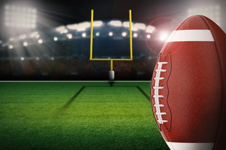 3d rendering american football ball with field goal postの写真素材