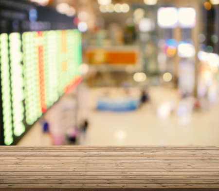 wooden table with airport blurred backgroundの写真素材