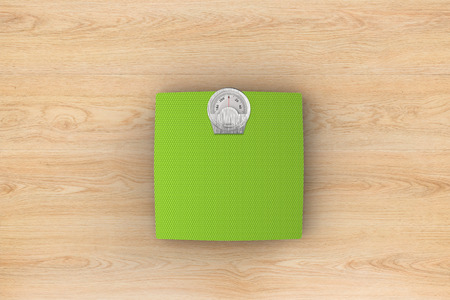 3d rendering weight scale on wooden backgroundの写真素材