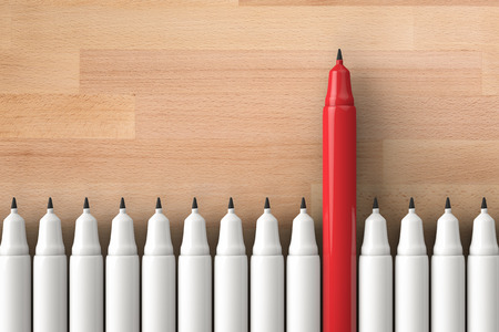 leadership concept with red pen among white pensの写真素材