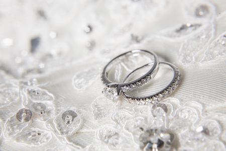 two wedding rings with diamond on platinum ringsの写真素材