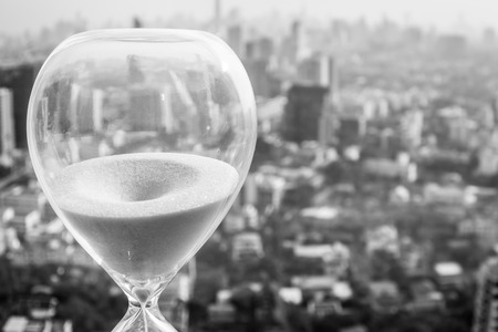 hourglass or sandglass with cityscape backgroundの写真素材