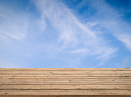 timber wooden floor with blue sky backgroundの写真素材